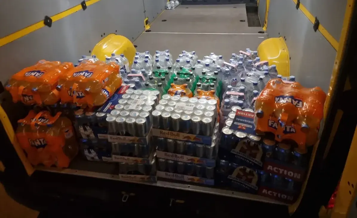 A yellow van loaded with cargo